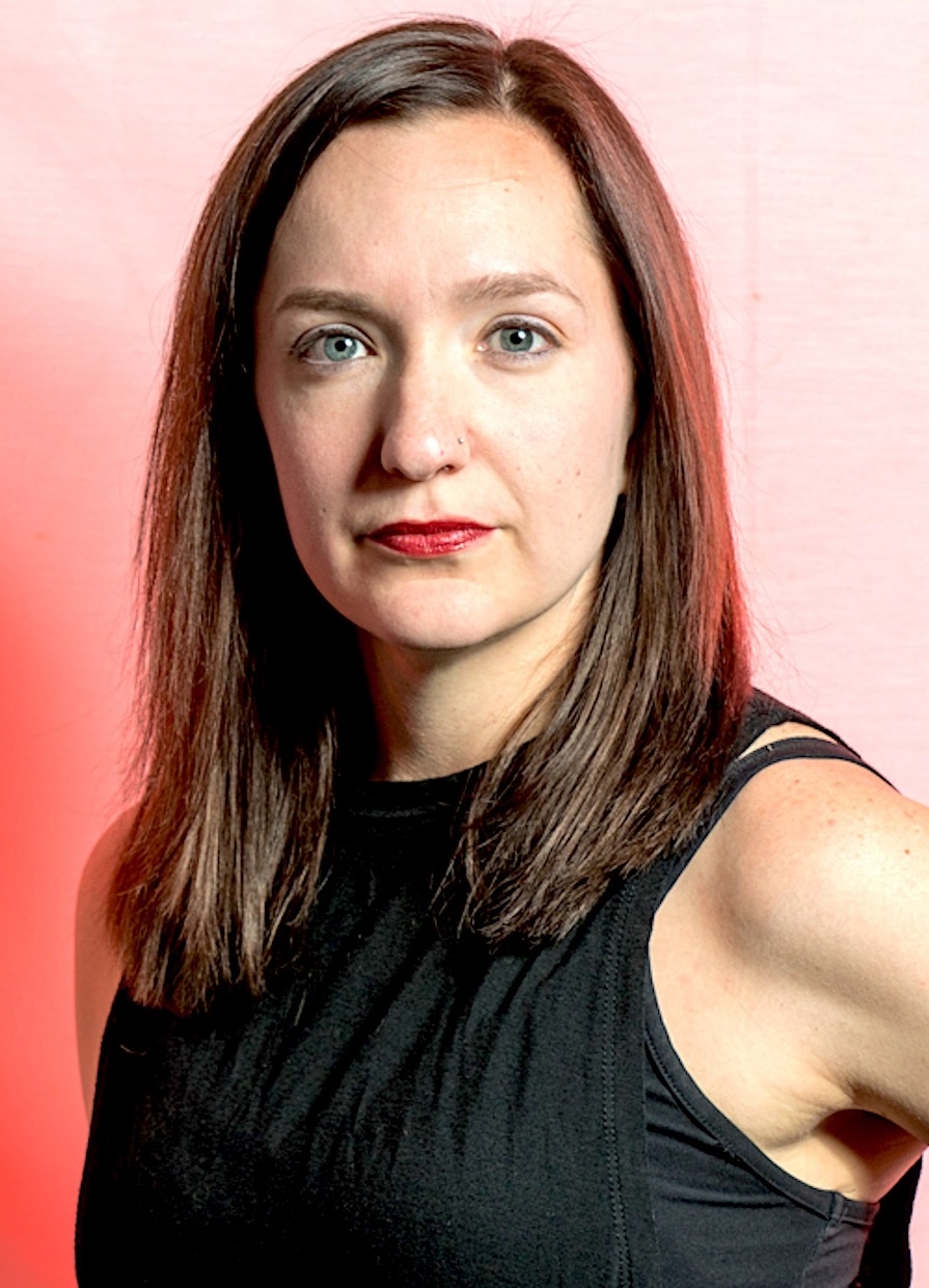 Headshot of Joanna Leeds on a red background