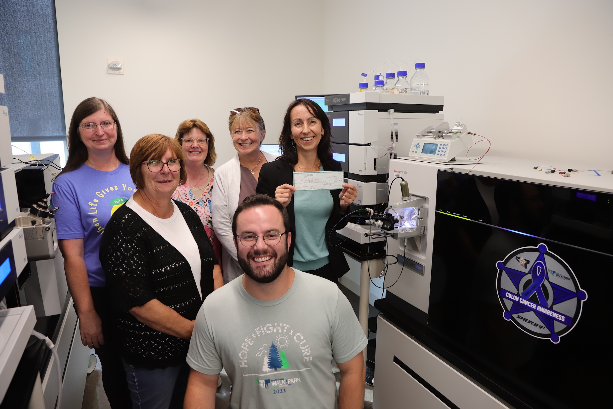 Dr. Balbo poses next to members of the RC Walk in the Park group in one of her lab rooms on the UMN Twin Cities campus.