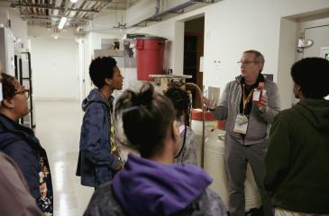 Chris Pennell and M-ASCEND students explore a laboratory cold room.